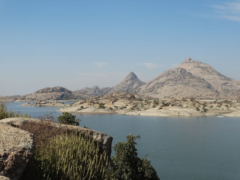 Jawai dam with granite peaks behind it